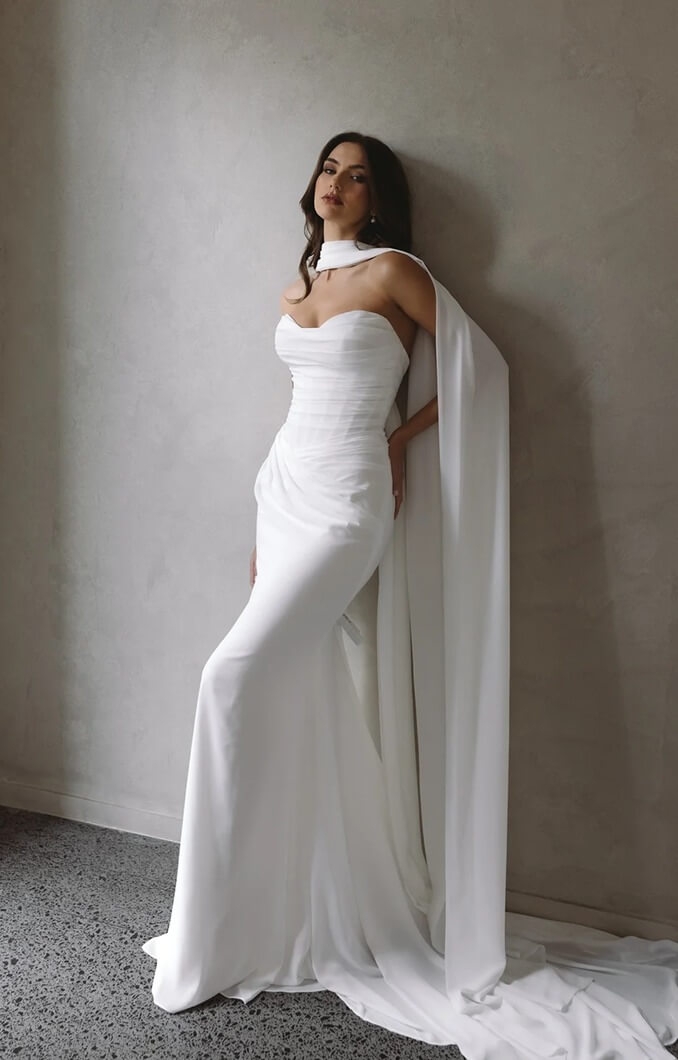 Model wearing a gown by Trish Peng